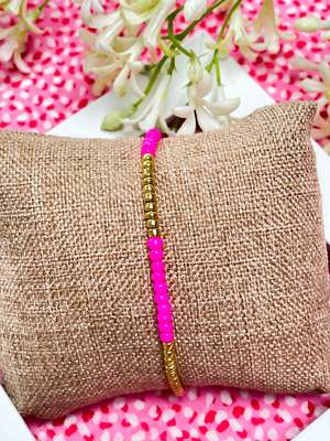 Charmant kralenarmbandje fuchsia roze / goud