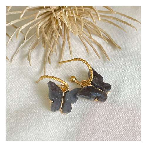 Gouden oorbelletjes black butterfly.